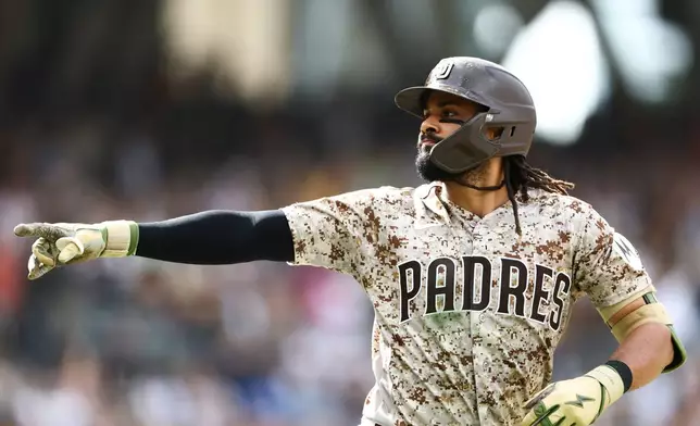 San Diego Padres' Fernando Tatis Jr. celebrates after hitting a home run in the seventh inning of a baseball game against the Miami Marlins, Sunday, Sept. 20, 2026, in San Diego. (AP Photo/Karl Anderson)