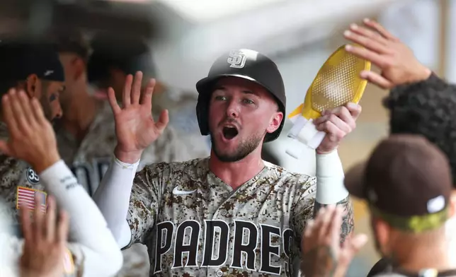 San Diego Padres' Jackson Merrill celebrates after scoring off Jake Cronenworth's double in the fourth inning of a baseball game against the Miami Marlins, Sunday, Sept. 20, 2026, in San Diego. (AP Photo/Karl Anderson)