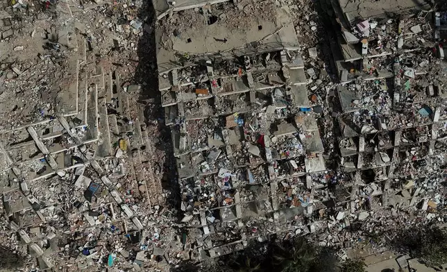 FILE - Buildings are in ruins three days after earthquakes struck La Guaira, Venezuela, June 27, 2026. (AP Photo/Matias Delacroix)