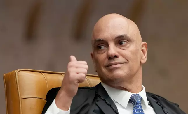 Supreme Court Justice Alexandre de Moraes gives a thumbs-up during a plenary session of the court in Brasilia, Brazil, Wednesday, Sept. 2, 2026. (AP Photo/Eraldo Peres)