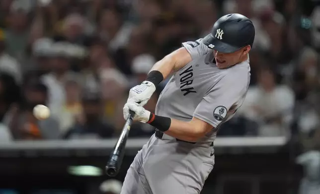 New York Yankees' Ben Rice hits a home run during the third inning of a baseball game against the San Diego Padres Friday, Sept. 4, 2026, in San Diego. (AP Photo/Gregory Bull)