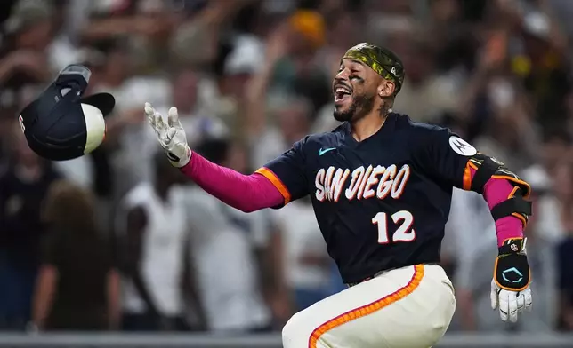 San Diego Padres' Luis Campusano celebrates with teammates after hitting a two-run, walk off home run during the tenth inning of a baseball game against the New York Yankees Friday, Sept. 4, 2026, in San Diego. (AP Photo/Gregory Bull)