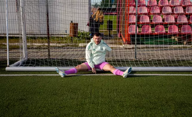 Maccabi Haifa's Trigan Chagava stretches before an amputee soccer match between Maccabi Haifa and Panathinaikos in the inaugural EAFF Conference League in Bucharest, Romania, Thursday, Sept. 24, 2026. (AP Photo/Andreea Alexandru)