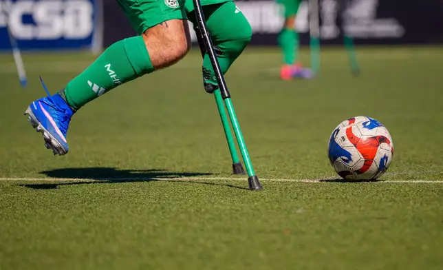 A Maccabi Haifa player follows the ball during an amputee soccer match between Maccabi Haifa and Panathinaikos in the inaugural EAFF Conference League in Bucharest, Romania, Thursday, Sept. 24, 2026. (AP Photo/Andreea Alexandru)