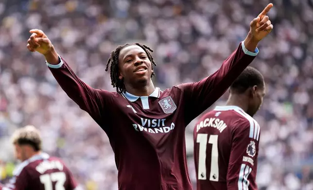 Aston Villa's Johan Manzambi celebrates as he scores the opening goal during the English Premier League soccer match between Tottenham Hotspur and Aston Villa, at Tottenham Hotspur Stadium in London, Saturday, Sept. 19, 2026. (Andrew Matthews/PA via AP)