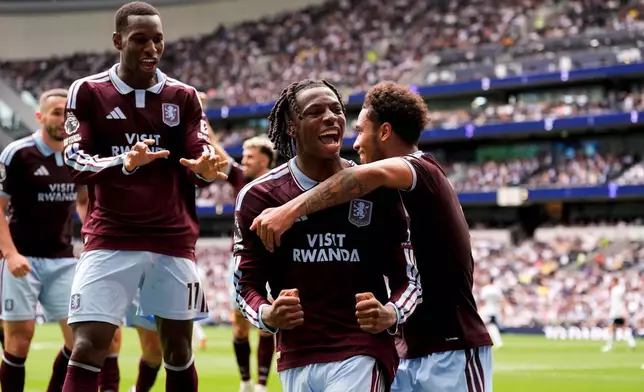 Aston Villa's Johan Manzambi celebrates with teammates after scoring the opening goal during the English Premier League soccer match between Tottenham Hotspur and Aston Villa, at Tottenham Hotspur Stadium in London, Saturday, Sept. 19, 2026. (Andrew Matthews/PA via AP)