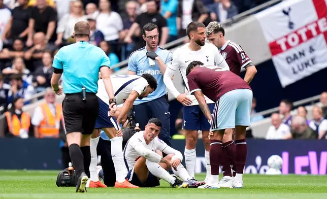 Tottenham Hotspur's Pedro Porro sits injured during the English Premier League soccer match between Tottenham Hotspur and Aston Villa, at Tottenham Hotspur Stadium in London, Saturday, Sept. 19, 2026. (Andrew Matthews/PA via AP)