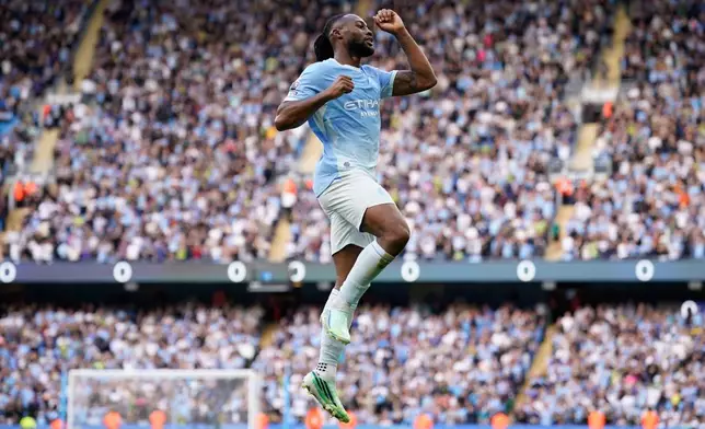 Manchester City's Antoine Semenyo reacts after scoring third goal during the English Premier League soccer match between Manchester City and Sunderland in Manchester, England, Sunday, Sept. 20, 2026. (AP Photo/Dave Thompson)