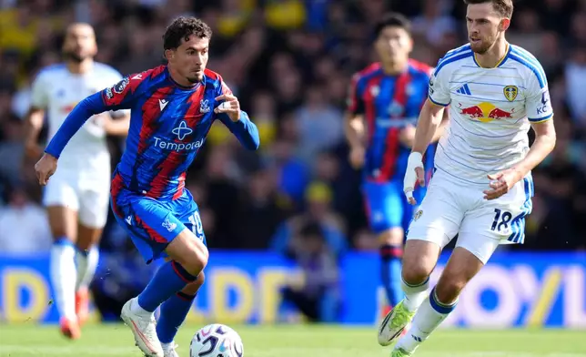 Crystal Palace's Yeremy Pino, left, and Leeds United's Anton Stach battle for the ball during their English Premier League soccer match in Leeds, England, Sunday, Sept. 20, 2026. (Annabel Lee-Ellis/PA via AP)