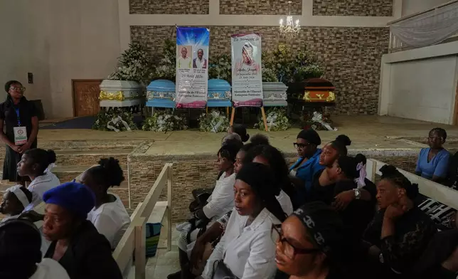 Relatives attend the funeral service for victims of a gang attack in the Kenscoff neighborhood of Port-au-Prince, Haiti, Wednesday, Sept. 2, 2026. (AP Photo/Odelyn Joseph)