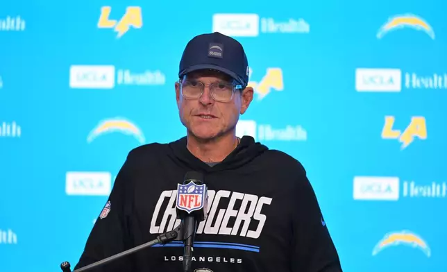 Los Angeles Chargers head coach Jim Harbaugh answers questions after an NFL football game against the Las Vegas Raiders in Inglewood, Calif., Sunday, Sept. 20, 2026. (AP Photo/Jayne Kamin-Oncea)