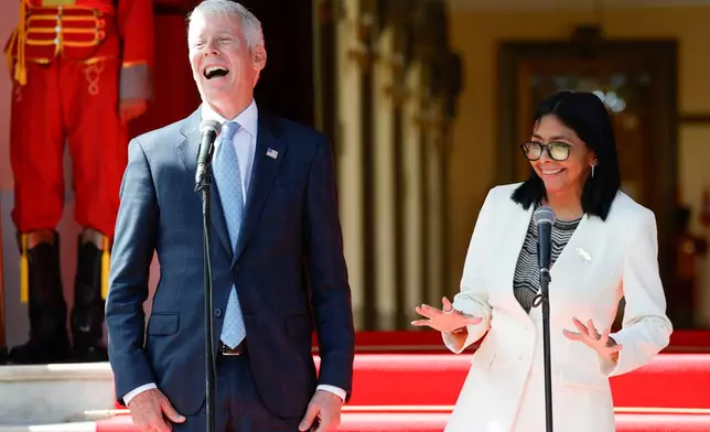 U.S. Energy Secretary Chris Wright, left, and Venezuelan acting President Delcy Rodriguez smile during a press conference after the signing of an oil agreement at Miraflores presidential palace in Caracas, Venezuela, Wednesday, Sept. 2, 2026. (AP Photo/Pedro Mattey)