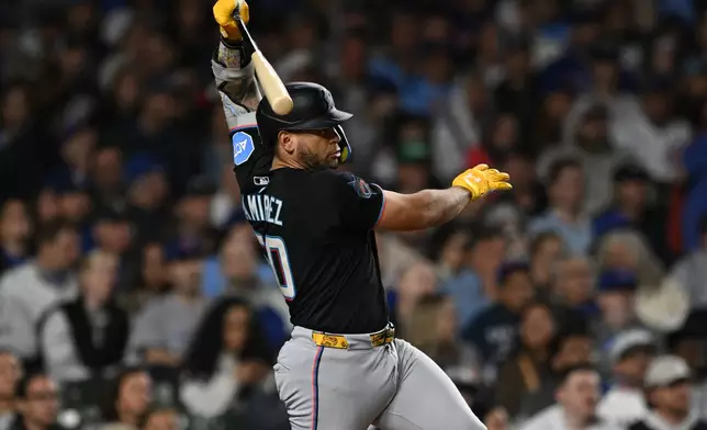 Miami Marlins' Agustin Ramirez watches his RBI single during the fourth inning of a baseball game against the Chicago Cubs Tuesday, Sept. 22, 2026, in Chicago. (AP Photo/Paul Beaty)