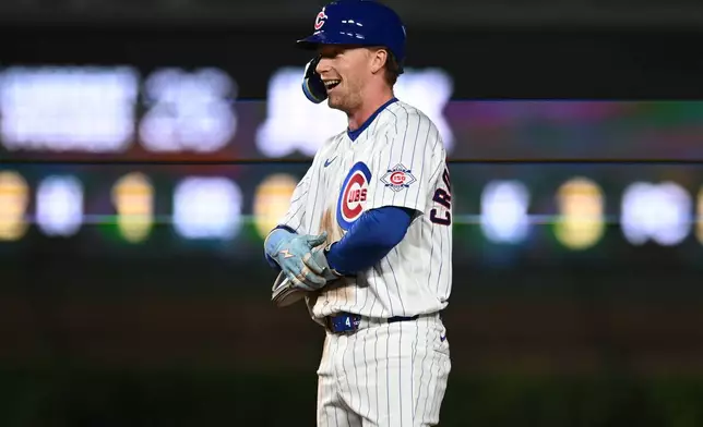 Chicago Cubs' Pete Crow-Armstrong celebrates after stealing second base during the third inning of a baseball game against the Miami Marlins Tuesday, Sept. 22, 2026, in Chicago. (AP Photo/Paul Beaty)