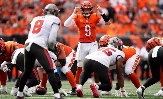 Cincinnati Bengals quarterback Joe Burrow (9) calls a play in the second half of an NFL football game against the Tampa Bay Buccaneers Sunday, Sept. 13, 2026, in Cincinnati. (AP Photo/Carolyn Kaster)