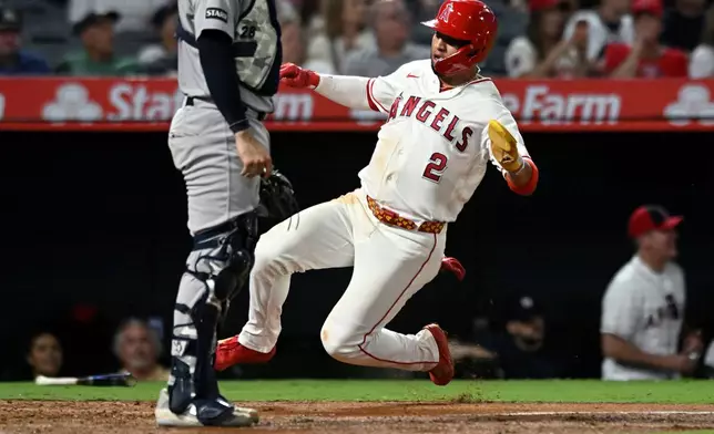 Los Angeles Angels' Oswald Peraza (2) scores against the New York Yankees in the fourth inning of a baseball game Monday, Aug. 31, 2026, in Anaheim, Calif. (AP Photo/Wally Skalij)