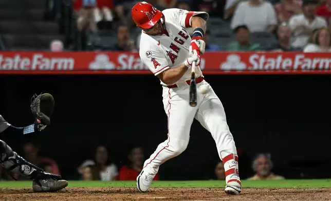 Los Angeles Angels' Mike Trout hits a two-run single against the New York Yankees in the fourth inning of a baseball game Monday, Aug. 31, 2026, in Anaheim, Calif. (AP Photo/Wally Skalij)