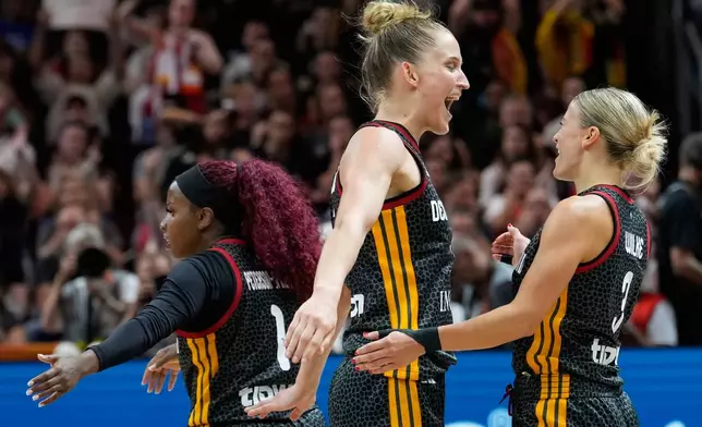 Germany's Leonie Fiebich, left, and Alexandra Wilke react during the Women's Basketball World Cup quarterfinal match between Germany and Belgium in Berlin, Thursday, Sept. 10, 2026. (AP Photo/Ebrahim Noroozi)