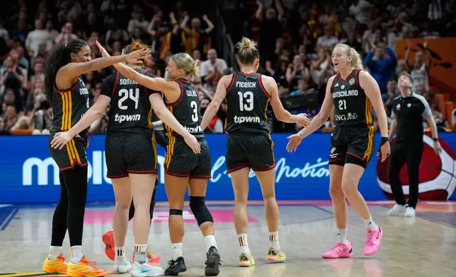 German players react during the Women's Basketball World Cup quarterfinal match between Germany and Belgium in Berlin, Thursday, Sept. 10, 2026. (AP Photo/Ebrahim Noroozi)