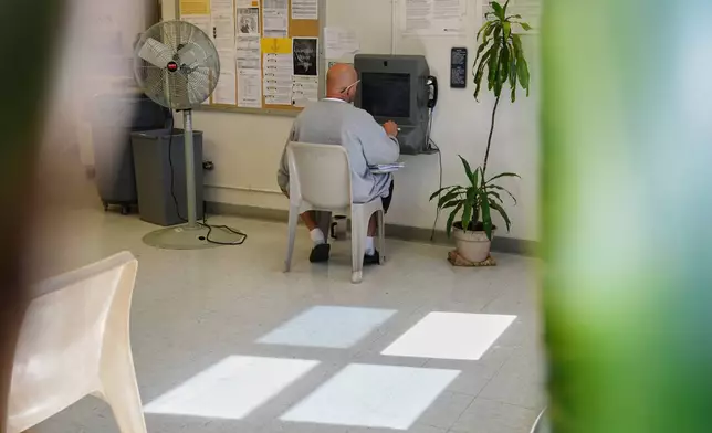 Fans are placed nearby while a person who is incarcerated has a virtual visit at a Minnesota Correctional Facility in Lino Lakes, Minn., Tuesday, Sept. 15, 2026. (AP Photo/Ellen Schmidt)