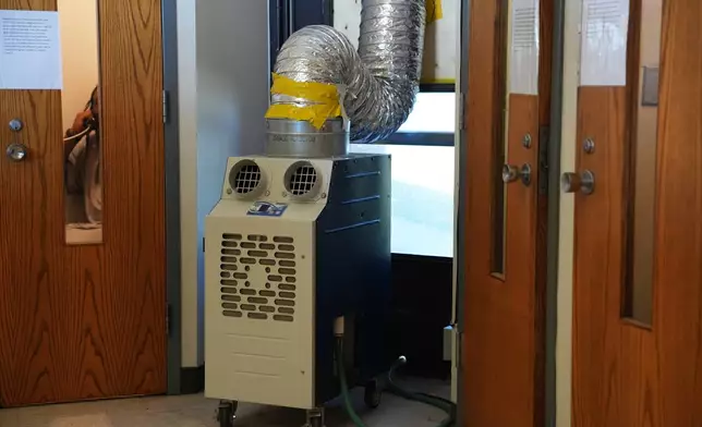 An air conditioning unit is placed in a housing unit at the Minnesota Correctional Facility in Lino Lakes, Minn., Tuesday, Sept. 15, 2026. (AP Photo/Ellen Schmidt)