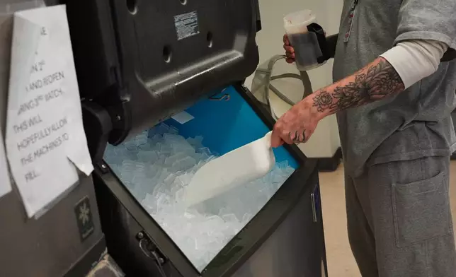 A person who is incarcerated scoops ice into his drink at a Minnesota Correctional Facility in Lino Lakes, Minn., Tuesday, Sept. 15, 2026. (AP Photo/Ellen Schmidt)