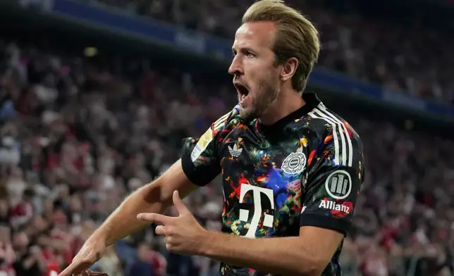 Bayern's Harry Kane celebrates after scoring his side's fourth goal during the Bundesliga soccer match between Bayern Munich and 1. FC Union Berlin in Munich, Germany, Friday, Sept. 18, 2026. (AP Photo/Matthias Schrader)