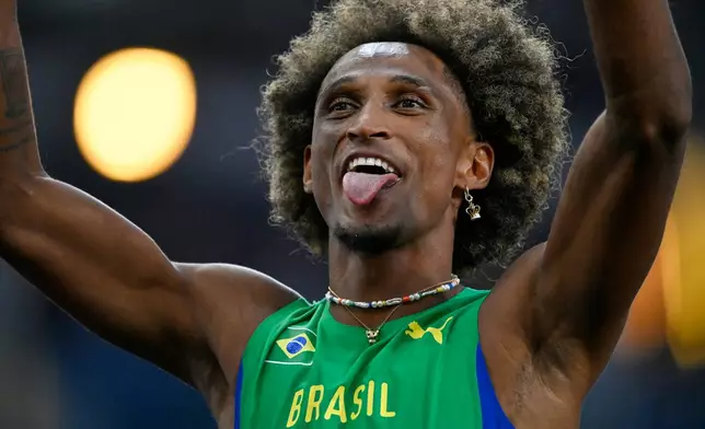 Alison dos Santos, of Brazil, reacts after winning the men's 400 meters hurdles final during the World Athletics Ultimate Championship in Budapest, Hungary, Sunday, Sept. 13, 2026. (AP Photo/Denes Erdos)