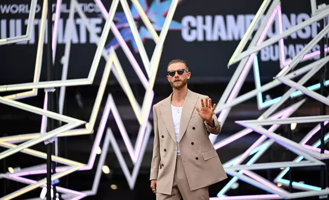 Josh Kerr of Britain poses on the red carpet during the formal opening of the World Athletics Ultimate Championship in Budapest, Hungary, Thursday, Sept. 10, 2026. (AP Photo/Denes Erdos)