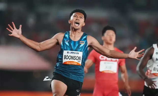 Thailand's Puripol Boonson celebrates after finishing first in the men's 100-meter final at the Asian Games in Nagoya, Japan, Friday, Sept. 25, 2026. (AP Photo/Lee Jin-man)