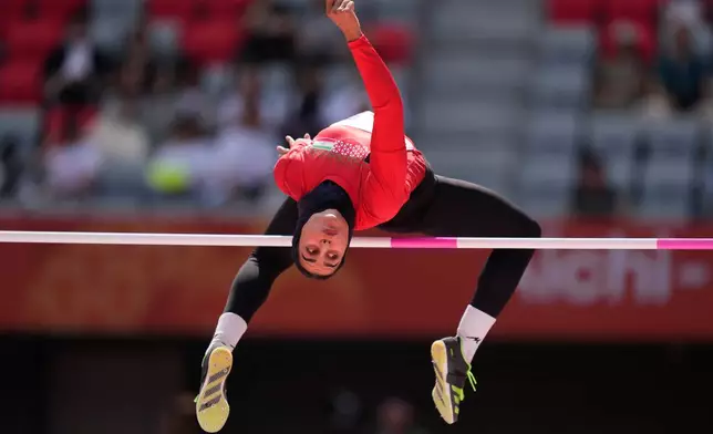 Iran's Fatemeh Mohitzadeh competes in the women's heptathlon high jump at the Asian Games in Nagoya, Japan, Thursday, Sept. 24, 2026. (AP Photo/Dita Alangkara)
