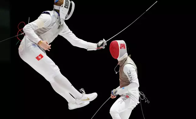 Cheung Ka Long of Hong Kong, left, competes against Shunsuke Baba of Japan in the men's foil team fencing final at the Asian Games in Tokoname, Japan, Friday, Sept. 25, 2026. (AP Photo/Eugene Hoshiko)