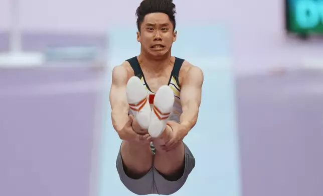 Ng Ka Ki of Hong Kong competes on the vault during the men's artistic gymnastics qualification at the Asian Games in Nagoya, Japan, Monday, Sept. 21, 2026. (AP Photo/Lee Jin-man)