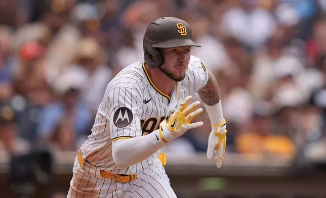 San Diego Padres' Jackson Merrill watches his RBI single during the eighth inning of a baseball game against the Washington Nationals Wednesday, Sept. 9, 2026, in San Diego. (AP Photo/Gregory Bull)