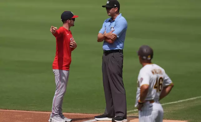 Washington Nationals manager Blake Butera, left, talks with first base umpire Emil Jimenez before being ejected during the third inning of a baseball game against the San Diego Padres Wednesday, Sept. 9, 2026, in San Diego. (AP Photo/Gregory Bull)