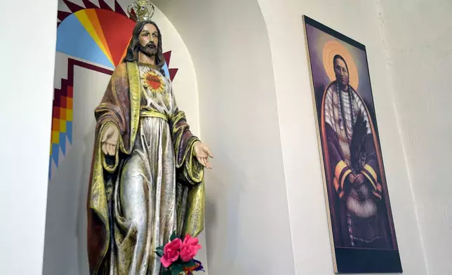 Native American imagery is displayed at the St. Stephens Indian Mission Catholic church in Arapahoe, Wyo., on Monday, Aug. 17, 2026. (AP Photo/Thomas Peipert)