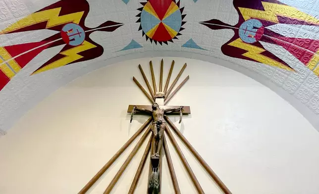 Native American imagery is displayed on the ceiling of the St. Stephens Indian Mission Catholic church in Arapahoe, Wyo., on Monday, Aug. 17, 2026. (AP Photo/Thomas Peipert)