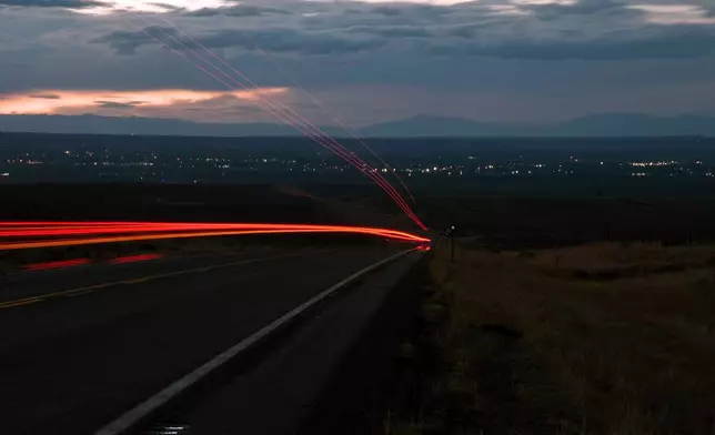 A truck passes through the Wind River Reservation on its way to Riverton, Wyo., on Saturday, Aug. 15, 2026. (AP Photo/Thomas Peipert)