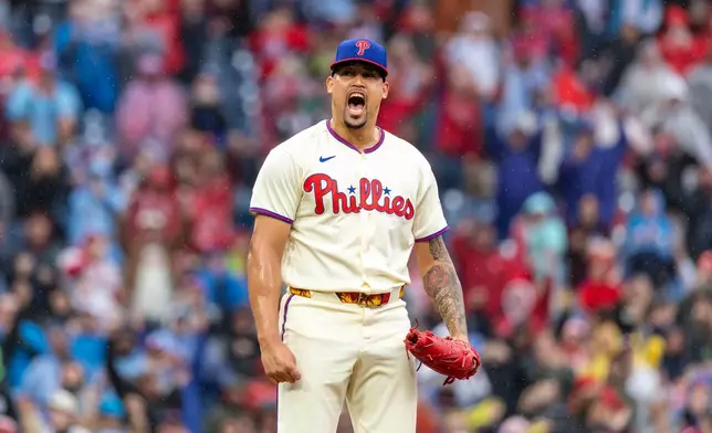 Philadelphia Phillies pitcher Jhoan Duran reacts after the last pitch of a baseball game against the Tampa Bay Rays, clinching a Wild Card slot in the postseason, Sunday, Sept. 27, 2026, in Philadelphia. (AP Photo/Laurence Kesterson)