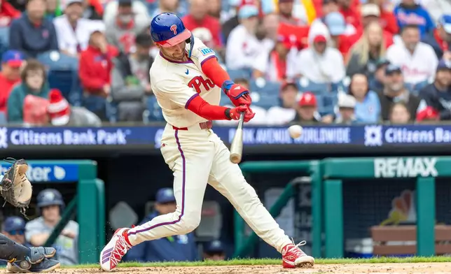 Philadelphia Phillies' Trea Turner hits an RBI single during the second inning of a baseball game against the Tampa Bay Rays, Sunday, Sept. 27, 2026, in Philadelphia. (AP Photo/Laurence Kesterson)