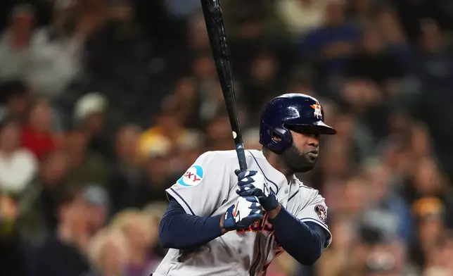 Houston Astros' Yordan Alvarez follows through on a double against the Seattle Mariners during the third inning of a baseball game, Wednesday, Sept. 23, 2026, in Seattle. (AP Photo/Lindsey Wasson)