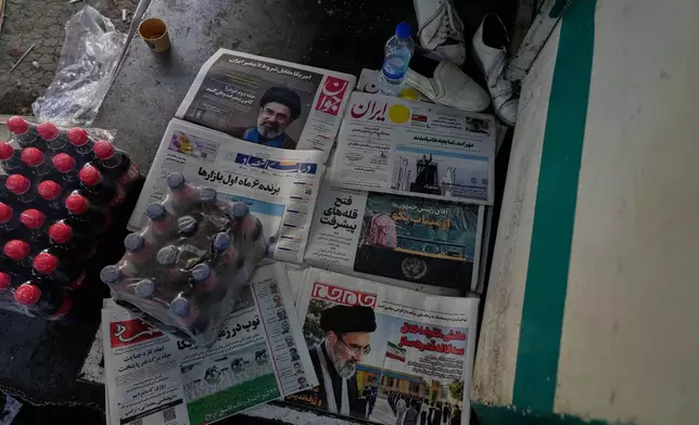 The front pages of Iranian newspapers show portraits of the Iranian Supreme Leader Ayatollah Mojtaba Khamenei, and headlines regarding the Shajareh Tayyebeh school that was hit in a Feb. 28 U.S. airstrike in Minab, at a square in northern Tehran, Iran, Wednesday, Sept. 23, 2026. (AP Photo/Vahid Salemi)