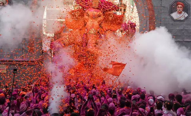 An idol of elephant-headed Hindu god Ganesha is taken for immersion on the final day of the ten-day long Ganesh Chaturthi festival in Mumbai, India, Friday, Sept. 25, 2026 (AP Photo/Rafiq Maqbool)