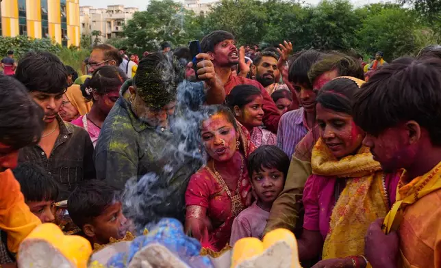 Devotees pray to an idol of the elephant-headed Hindu god Ganesha before immersion in a makeshift pond during Ganesh Visarjan in New Delhi, India, Friday, Sept. 25, 2026. (AP Photo/Manish Swarup)