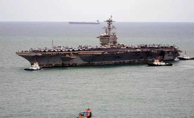 Tug boats greet the U.S. Navy aircraft carrier USS Abraham Lincoln as it arrives at the port in Laem Chabang, Chonburi, Thailand, Wednesday, Sept. 2, 2026. (AP Photo/Sakchai Lalit)