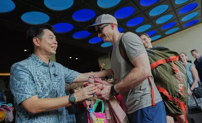 Pattaya City's Mayor Poramet Ngampichet gifts souvenirs to American service members from the USS Abraham Lincoln strike group at hotel in Pattaya, Thailand, Wednesday, Sept. 2, 2026. (AP Photo/Sakchai Lalit)