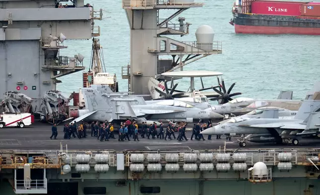 Navy personnel walk on the deck of the U.S. Navy aircraft carrier USS Abraham Lincoln as it arrives at the port in Laem Chabang, Chonburi, Thailand, Wednesday, Sept. 2, 2026. (AP Photo/Sakchai Lalit)