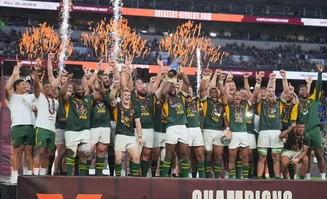 South African players celebrate after defeating the All Blacks in their rugby international in Baltimore, USA, Saturday, Sept. 12, 2026. (AP Photo/Stephanie Scarbrough)