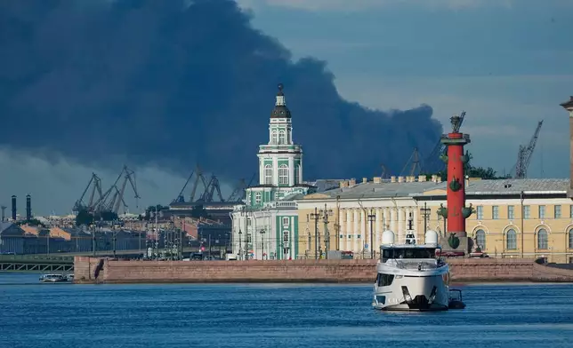 FILE - A plume of black smoke rises over the port of St. Petersburg, Russia, on June 3, 2026, after a Ukrainian drone attack. (AP Photo, File)