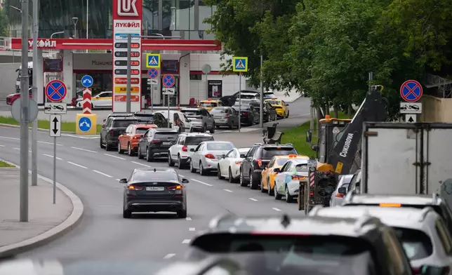 FILE - Cars line up at a Lukoil gas station in Moscow, Monday, June 29, 2026. (AP Photo/Pavel Bednyakov, File)